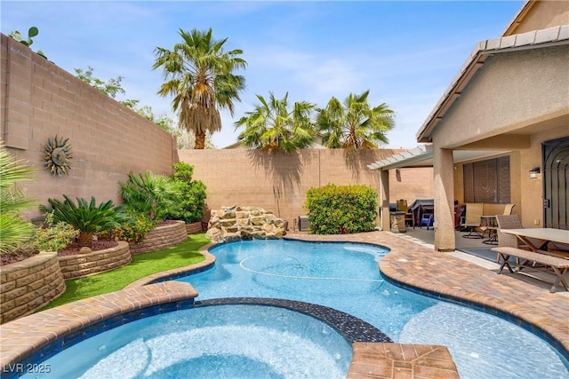 7013 Bisoni St, Las Vegas, NV 89149 - view of swimming pool featuring a fenced backyard, a pool with connected hot tub, and a patio