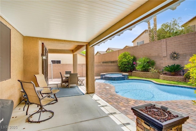 7013 Bisoni St, Las Vegas, NV 89149 - view of pool with a patio area, a fenced backyard, a fire pit, and a pool with connected hot tub