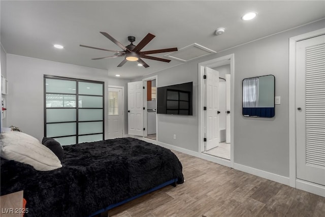 bedroom featuring recessed lighting, baseboards, wood finished floors, and attic access