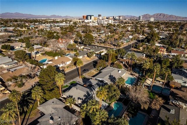 drone / aerial view featuring a residential view and a mountain view