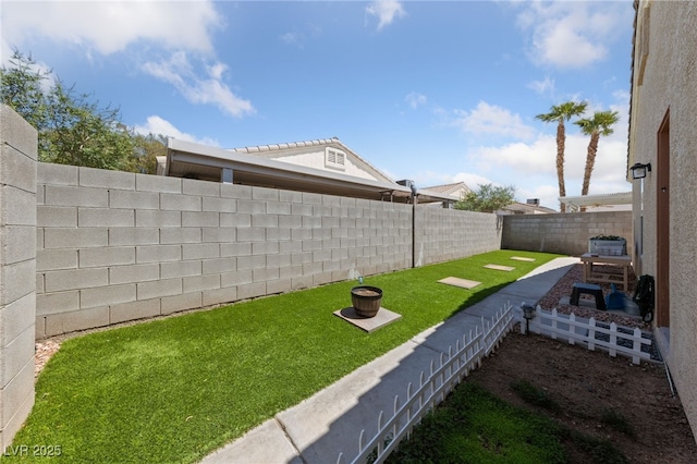 view of yard featuring a fenced backyard