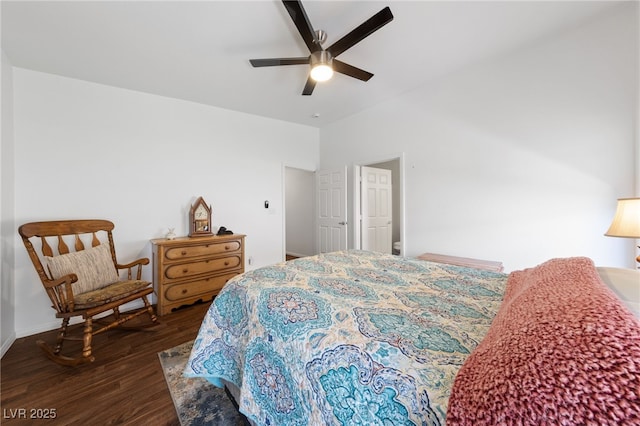 bedroom featuring dark wood-style flooring and ceiling fan