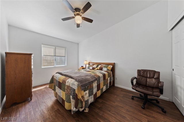 bedroom featuring baseboards, ceiling fan, wood finished floors, and vaulted ceiling
