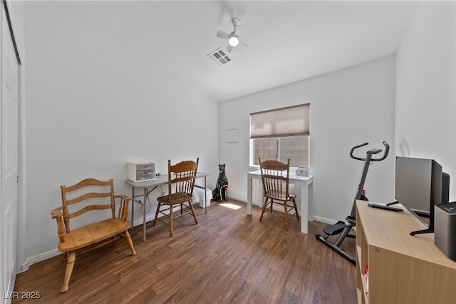 office area featuring a ceiling fan, baseboards, visible vents, and wood finished floors