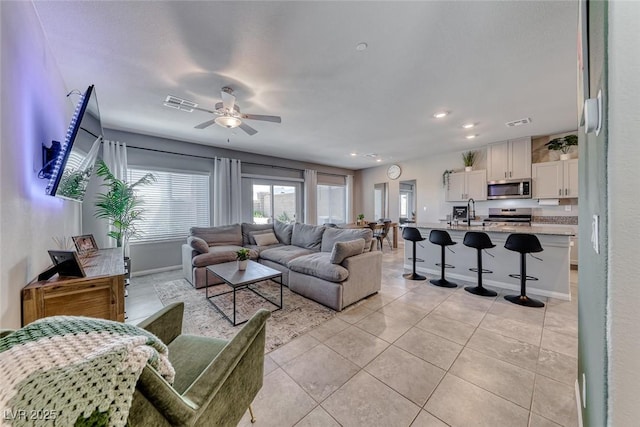 living room featuring visible vents, recessed lighting, ceiling fan, and light tile patterned floors
