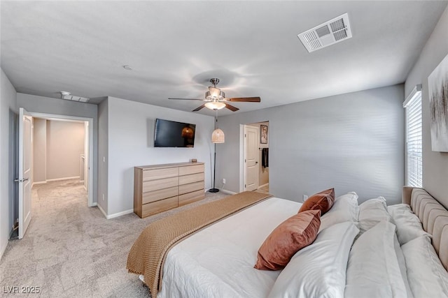 bedroom featuring visible vents, baseboards, ceiling fan, and light carpet