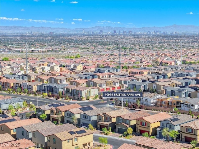 drone / aerial view with a mountain view and a residential view