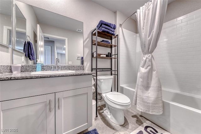 bathroom featuring shower / bath combo with shower curtain, toilet, and vanity