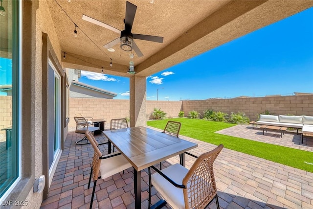 view of patio / terrace featuring ceiling fan, outdoor dining area, a fenced backyard, and an outdoor hangout area