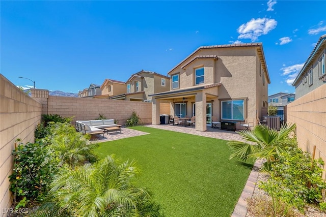 rear view of house featuring central AC, a patio, a fenced backyard, stucco siding, and an outdoor hangout area