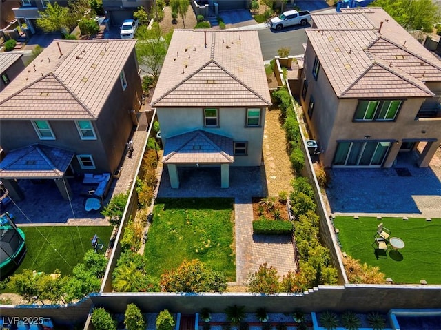 birds eye view of property with a residential view