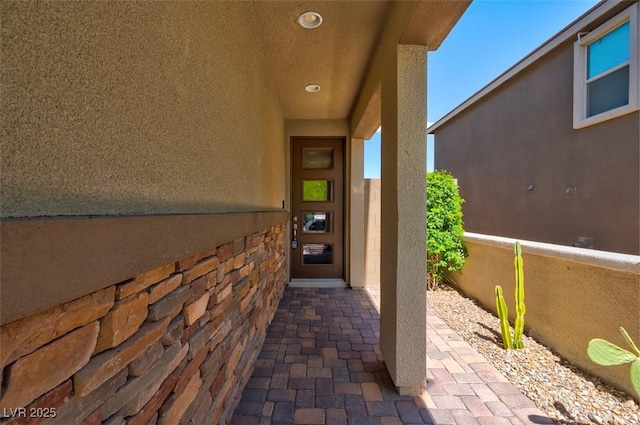 entrance to property with stucco siding