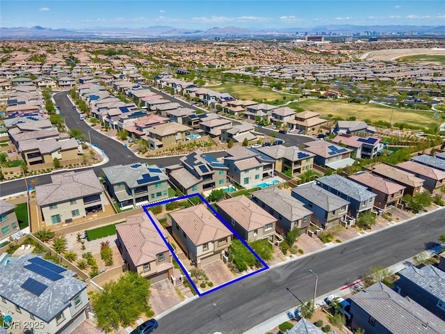 bird's eye view featuring a residential view and a mountain view