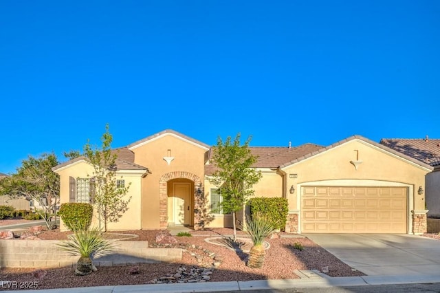 view of front facade with an attached garage, driveway, stone siding, and stucco siding