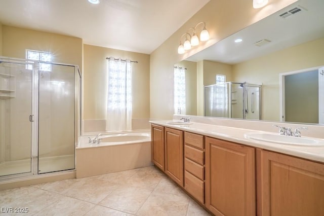 full bath with visible vents, a garden tub, double vanity, a shower stall, and a sink