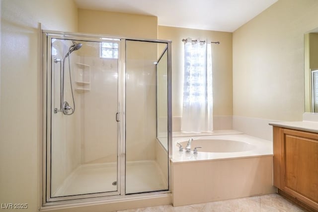 bathroom with vanity, a shower stall, and a bath