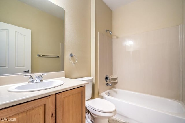 full bath featuring vanity, shower / bathing tub combination, and toilet