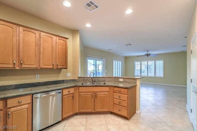 kitchen featuring a sink, a wealth of natural light, stainless steel dishwasher, and visible vents