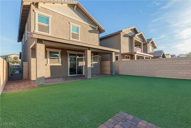 361 Andy Wheeler Dr, Henderson, NV 89011 - rear view of property with stucco siding, fence, and a gate