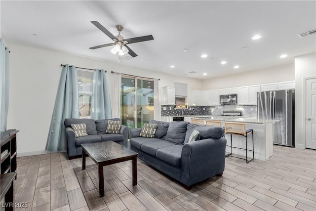 361 Andy Wheeler Dr, Henderson, NV 89011 - living area with ceiling fan, visible vents, wood finish floors, and recessed lighting