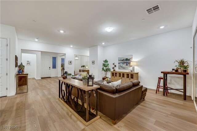 712 Webber Park St, Henderson, NV 89011 - living room with visible vents, recessed lighting, baseboards, and light wood-type flooring