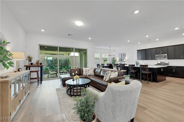 712 Webber Park St, Henderson, NV 89011 - living area with recessed lighting, a notable chandelier, visible vents, and light wood-type flooring