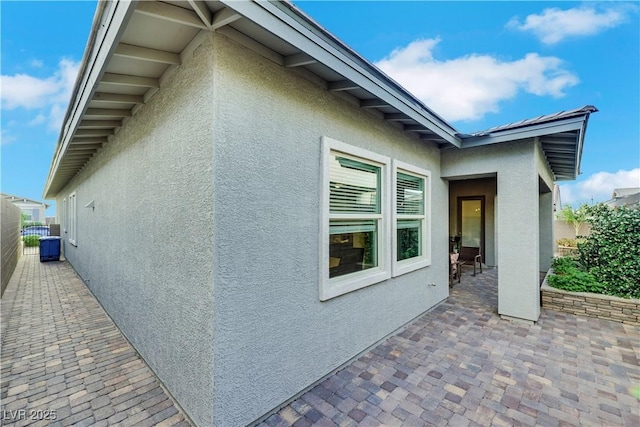 712 Webber Park St, Henderson, NV 89011 - view of home's exterior featuring fence, a patio area, and stucco siding