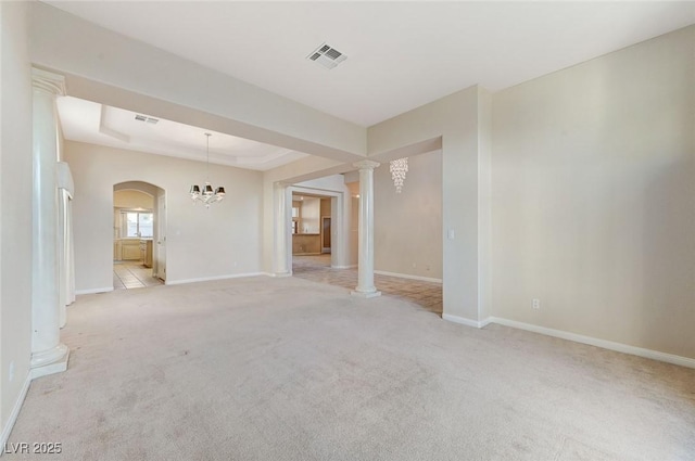 8052 Marbella Cir, Las Vegas, NV 89128 - unfurnished room featuring light carpet, decorative columns, arched walkways, and baseboards