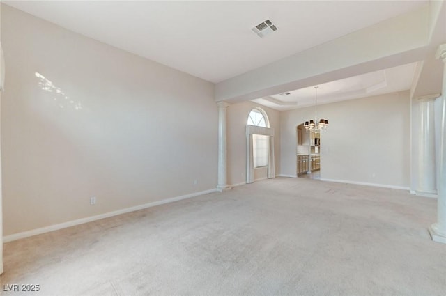 8052 Marbella Cir, Las Vegas, NV 89128 - spare room with decorative columns, a chandelier, baseboards, and light carpet