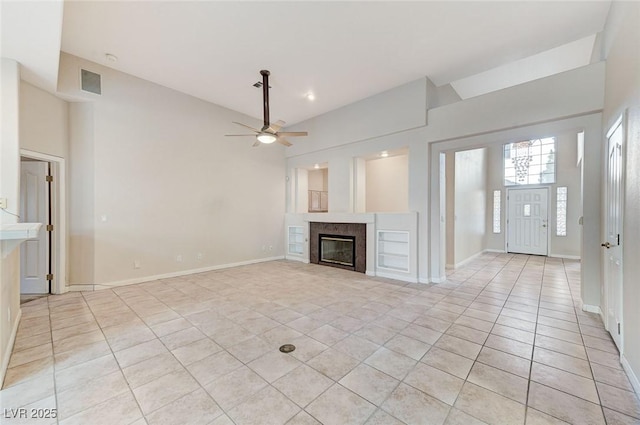 8052 Marbella Cir, Las Vegas, NV 89128 - unfurnished living room with a fireplace, light tile patterned floors, ceiling fan, vaulted ceiling, and baseboards