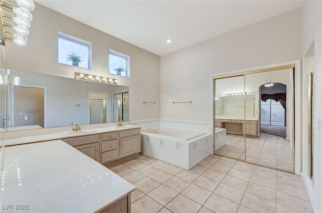 8052 Marbella Cir, Las Vegas, NV 89128 - full bath with vanity, tile patterned flooring, a bath, healthy amount of natural light, and recessed lighting
