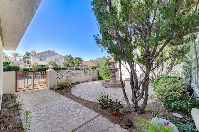 8052 Marbella Cir, Las Vegas, NV 89128 - view of patio / terrace featuring a gate