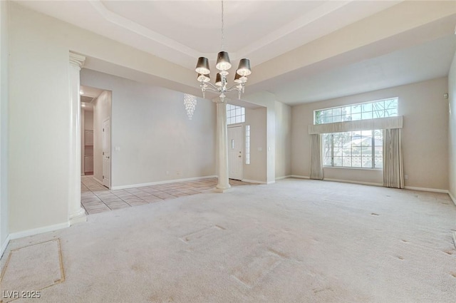 8052 Marbella Cir, Las Vegas, NV 89128 - carpeted empty room featuring healthy amount of natural light, baseboards, and a chandelier