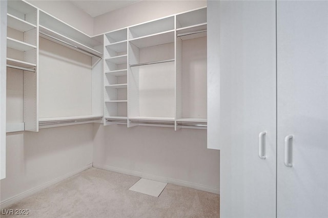 8052 Marbella Cir, Las Vegas, NV 89128 - spacious closet featuring carpet floors
