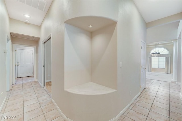 8052 Marbella Cir, Las Vegas, NV 89128 - corridor featuring light tile patterned floors and baseboards