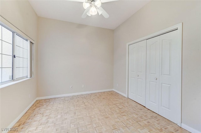 8052 Marbella Cir, Las Vegas, NV 89128 - unfurnished bedroom featuring baseboards, a closet, and a ceiling fan