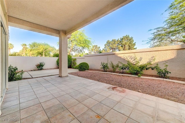 8052 Marbella Cir, Las Vegas, NV 89128 - fenced backyard featuring a patio
