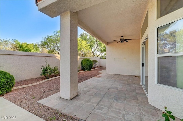 8052 Marbella Cir, Las Vegas, NV 89128 - fenced backyard featuring a ceiling fan and a patio area