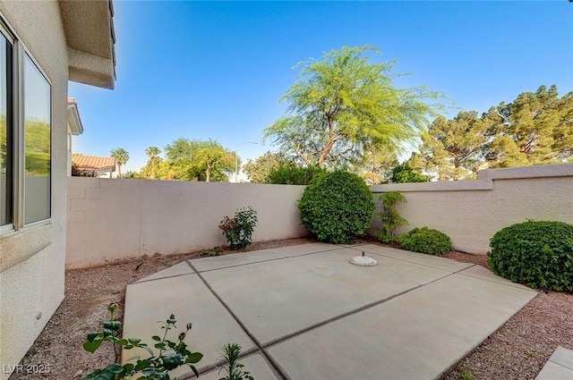 8052 Marbella Cir, Las Vegas, NV 89128 - fenced backyard with a patio