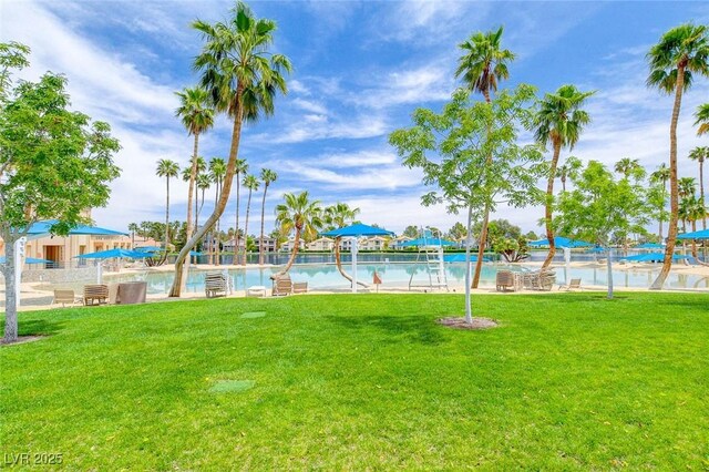 8052 Marbella Cir, Las Vegas, NV 89128 - view of grassy yard featuring a community pool