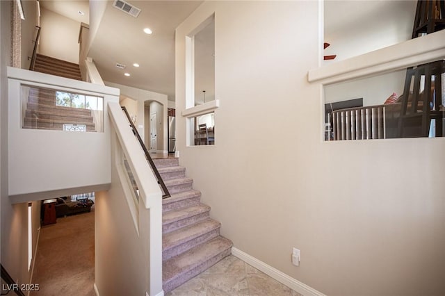 staircase featuring recessed lighting, baseboards, marble finish floor, and visible vents