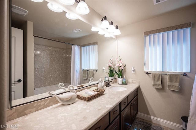 full bath featuring baseboards, vanity, curtained shower, and visible vents