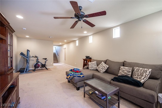 living room featuring stairway, a ceiling fan, recessed lighting, and light colored carpet