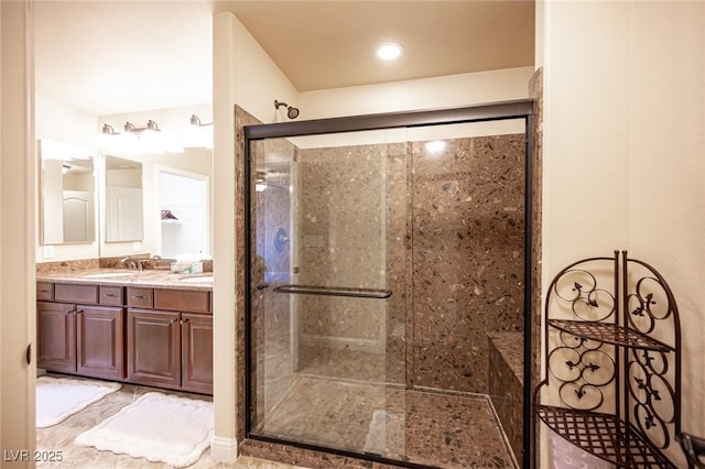 bathroom featuring vanity and a shower stall