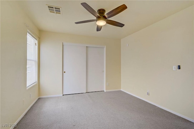 9932 Keephills St, Las Vegas, NV 89183 - unfurnished bedroom featuring baseboards, multiple windows, carpet, and visible vents