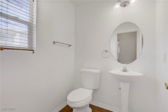 9932 Keephills St, Las Vegas, NV 89183 - bathroom featuring baseboards and toilet