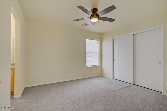 9932 Keephills St, Las Vegas, NV 89183 - unfurnished bedroom featuring visible vents, arched walkways, baseboards, and light colored carpet