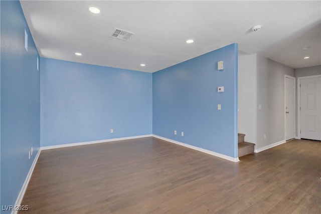 9932 Keephills St, Las Vegas, NV 89183 - unfurnished room featuring stairs, baseboards, visible vents, and wood finished floors