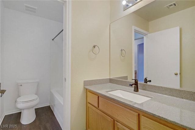 9932 Keephills St, Las Vegas, NV 89183 - bathroom featuring toilet, visible vents, wood finished floors, and vanity