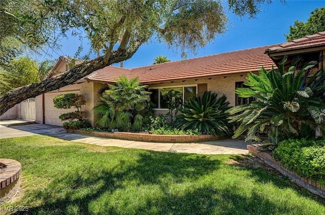 single story home with a garage, stucco siding, a front yard, concrete driveway, and a tiled roof